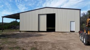 fully enclosed 49x100 with the 20 foot lean-to building with 2 sliding doors, in Boerne, TX